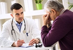 doctor and patient talking about prostate screening