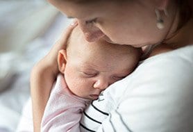 woman holding baby