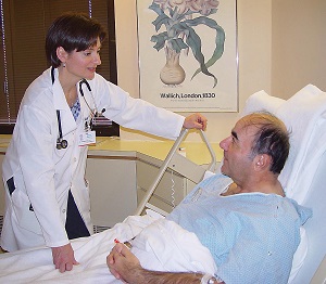 hospitalist speaking with patient in hospital