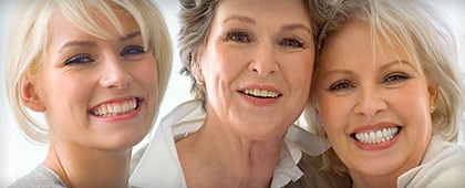 Three women smiling